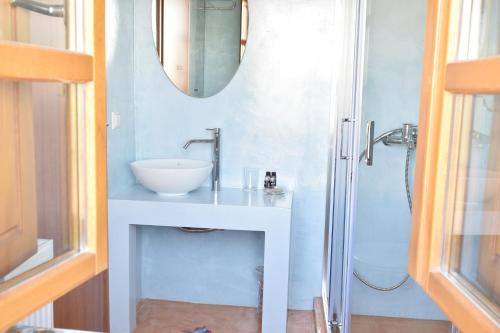 a bathroom with a sink and a shower at Great Mantineia in Levidi