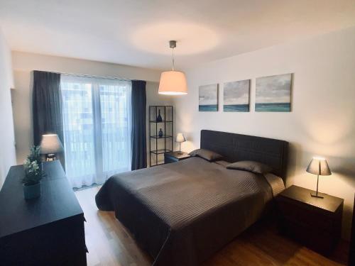 Postel nebo postele na pokoji v ubytování ART Garden Towers Prague