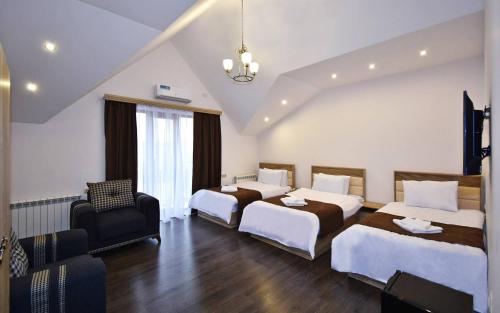 Postel nebo postele na pokoji v ubytování Patriott Hotel