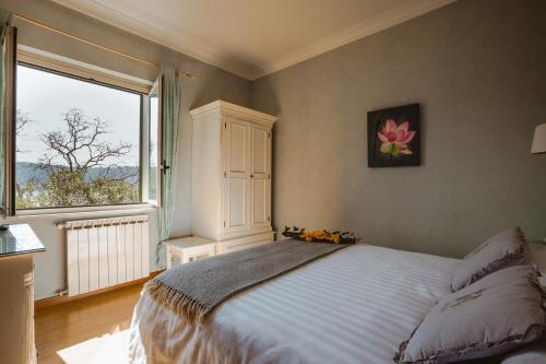 Postel nebo postele na pokoji v ubytování Hotel La Culla Del Lago