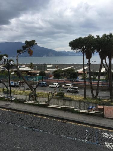 a view of a parking lot with trees and cars at Vient e mare (Sea wind) in Torre Annunziata
