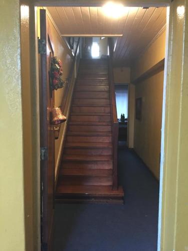 a stairway in a building with wooden steps at Eliodoro Yañez Casa o chalet in Valdivia