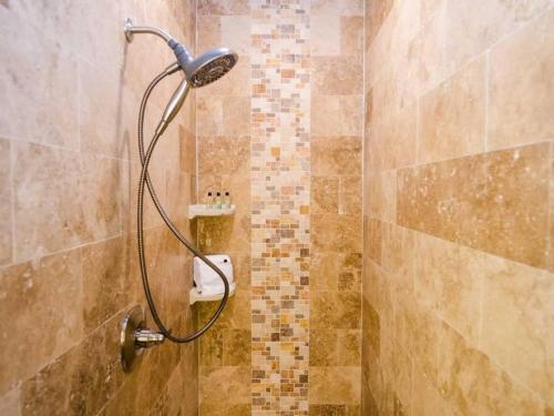 a shower with a shower head in a bathroom at 5 BEDROOM BEACHFRONT CONDO - 3rd Floor in South Padre Island