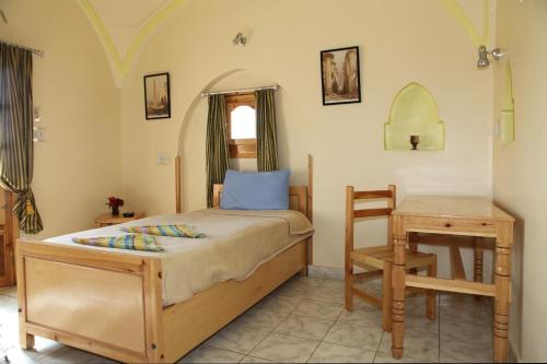 Postel nebo postele na pokoji v ubytování El Fayrouz Hotel
