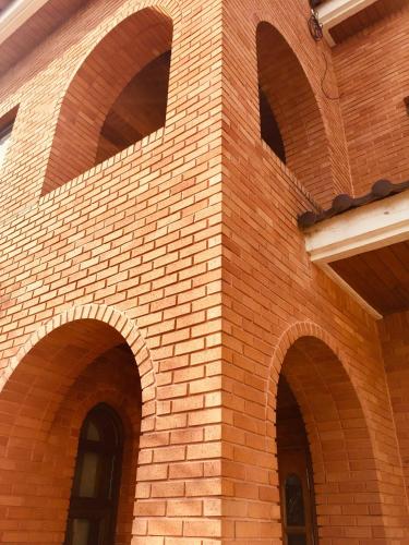 a brick building with arches on the side of it at BluePlanet in Gyeongju