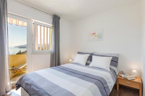 Postel nebo postele na pokoji v ubytování Apartment Dora