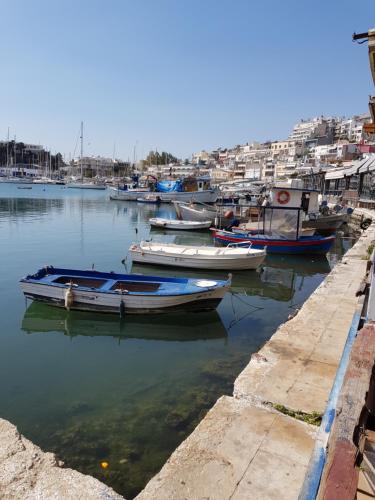 a group of boats are docked in a harbor at Poseidonio in Piraeus