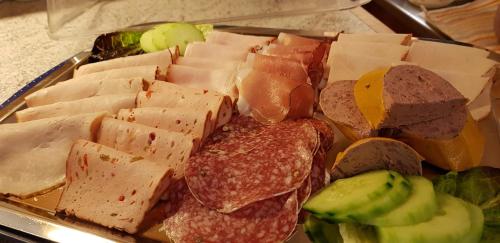 a plate of food with cheese and other foods at Haus Guentli in Mittelberg