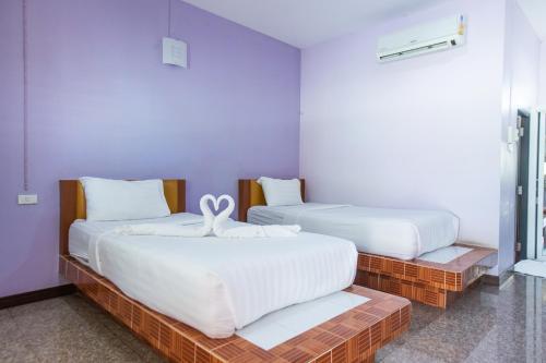 Postel nebo postele na pokoji v ubytování Jintana Resort