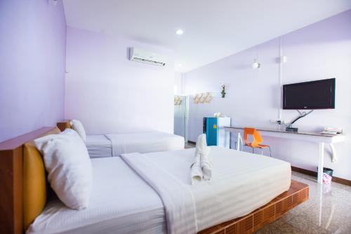 TV a/nebo společenská místnost v ubytování Jintana Resort