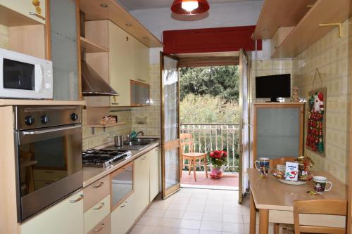 a kitchen with a sink and a stove top oven at Vacanze dai Re in Rome