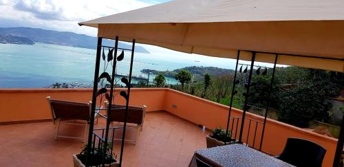 an orange balcony with a view of the water at La Finestra sul mare in La Spezia