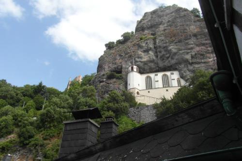 a church on the side of a mountain at Hotel Schloßschenke in Idar-Oberstein