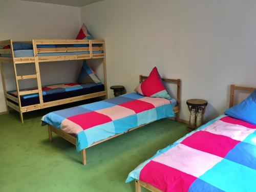 a room with two beds and a bunk bed at Bei Victoria in Ichenhausen