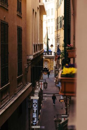 a view of an alley with people walking down the street at B&B La Casa del Cuoco - Piccola camera con colazione in appartamento condiviso con l'host in Genova
