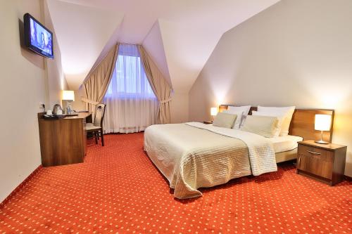 Кровать или кровати в номере Hotel Kantoria