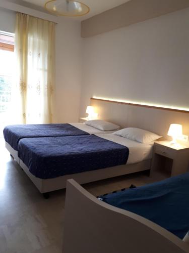 A bed or beds in a room at Sophie Studios