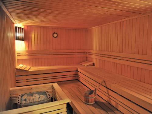 a large wooden sauna with a bench in it at Avala Resort & Villas in Budva