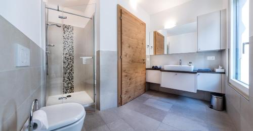 a bathroom with a shower and a toilet and a sink at Apartment 39012 in Merano