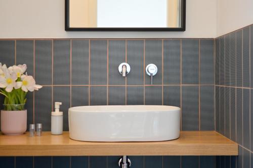 a white sink on a counter in a bathroom at Casa27 in Terracina