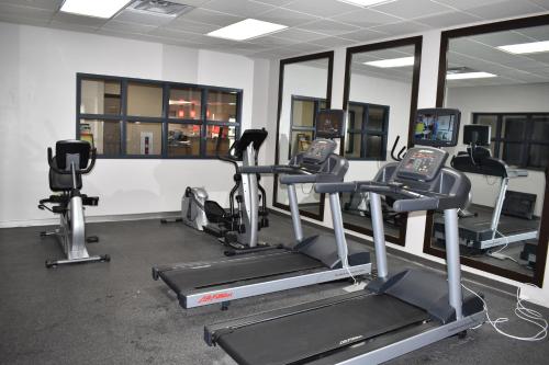 a gym with several tread machines in a room at Country Inn & Suites by Radisson, Hagerstown, MD in Hagerstown