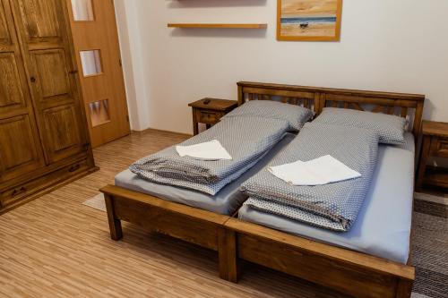 two beds sitting on a wooden platform in a room at Apartmány Hrady in Zuberec