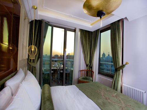 Postel nebo postele na pokoji v ubytování Taksim Star Hotel