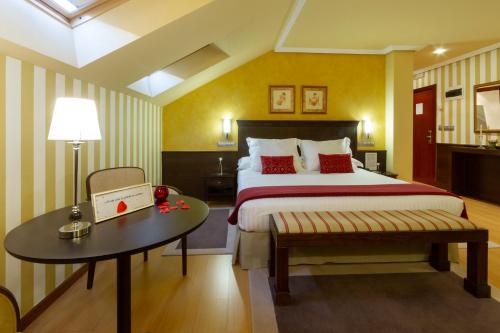 Säng eller sängar i ett rum på Hotel MIRAVALLE