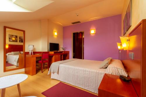 Hotel MIRAVALLEにあるベッド