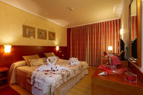 Hotel MIRAVALLEにあるベッド