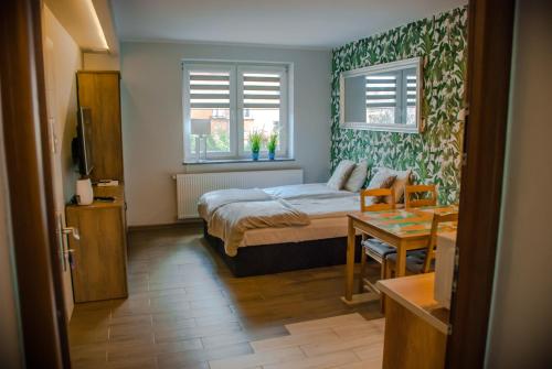 Voodi või voodid majutusasutuse Noclegi "Boczna 5a" Apartamenty gościnne toas