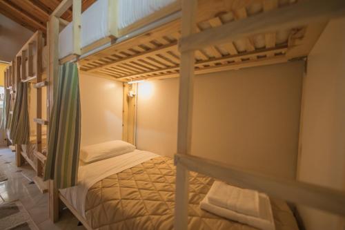 a couple of bunk beds in a room at Mosaic Home in Tirana