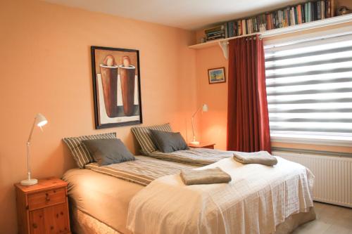 Llit o llits en una habitació de Siddy Apartment
