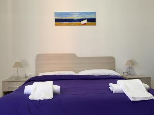 Katil atau katil-katil dalam bilik di Il Viaggiatore Via Rimini Serapo