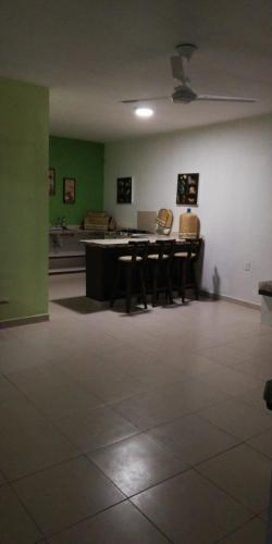 a room with a ping pong table and chairs at Hotel Villa Marán Chachalacas Ambiente Familiar in Chachalacas