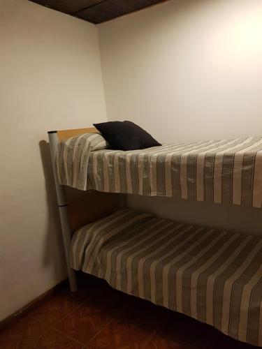 Ένα ή περισσότερα κρεβάτια σε δωμάτιο στο Casas de Raco