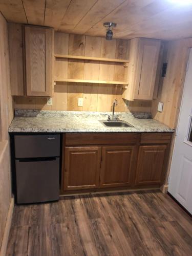 an empty kitchen with a sink and a counter at Chateau Tina in the Catskill Mountains in East Durham