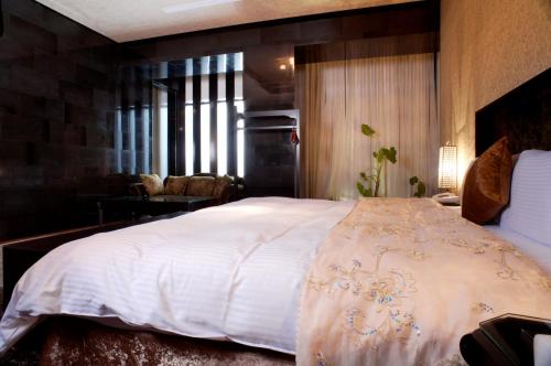 Postel nebo postele na pokoji v ubytování I DO Motel