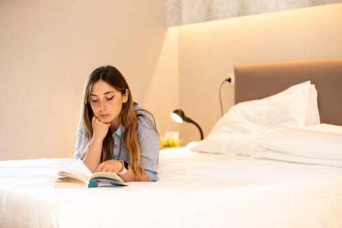Un ou plusieurs lits dans un hébergement de l'établissement Hotel Miranda