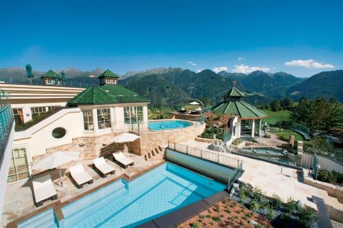 an aerial view of a resort with a swimming pool and mountains at Wellnessresidenz Schalber in Serfaus