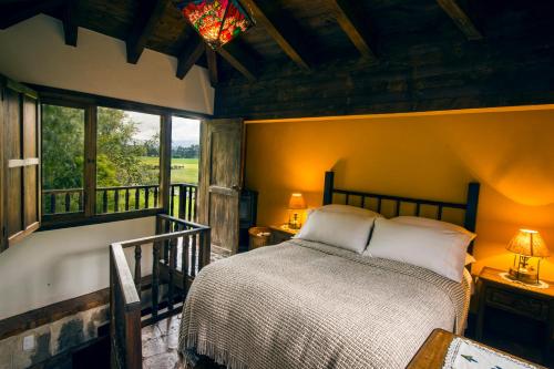 A bed or beds in a room at Hacienda Hato Verde