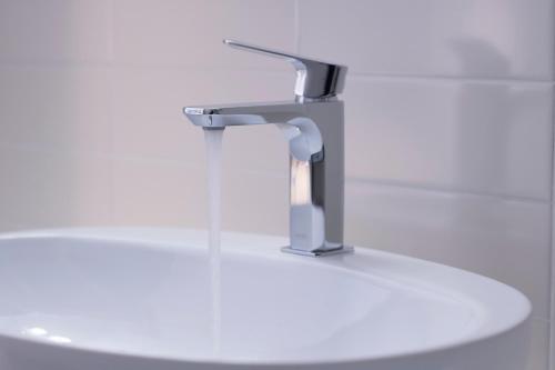 a bathroom sink with a faucet on top of it at Zia Pupetta Suites in Amalfi