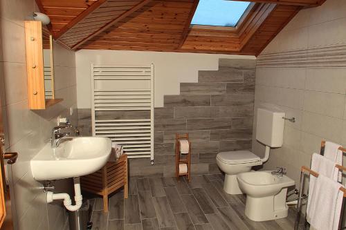a bathroom with a sink and a toilet at La Tegola in Como