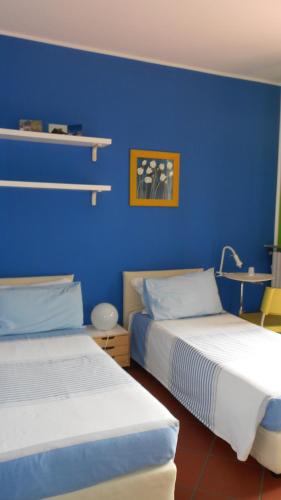 Un ou plusieurs lits dans un hébergement de l'établissement B&B Come A Casa