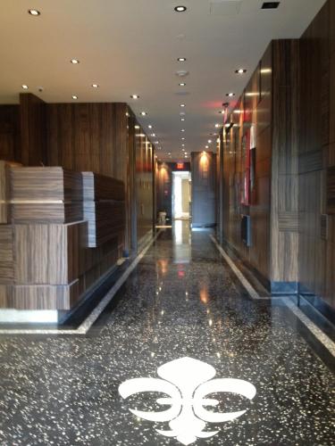 a hallway of a building with a sign on the floor at Opera House Hotel in Bronx
