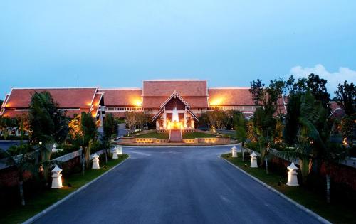 a large house with a road in front of it at Mission Hills Phuket Golf Resort-SHA Extra Plus in Por Bay