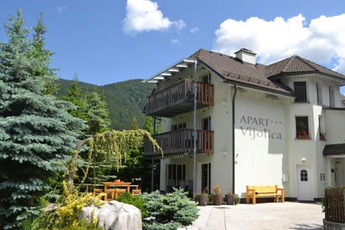 a building with a sign that reads art workshop at Apartments Vijolica in Kranjska Gora
