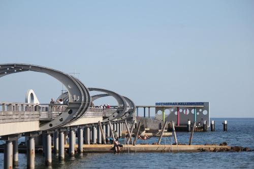 a roller coaster on a pier in the water at Sonnengarten 10 - Ruhepol in Kellenhusen
