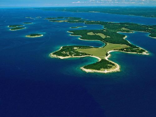 an aerial view of an island in the water at Villa Lanca in Fažana