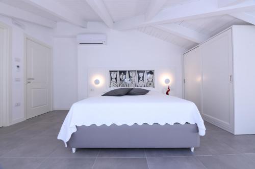 Кровать или кровати в номере Zia Pupetta Suites